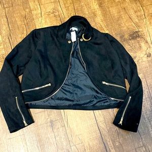 Black jacket with gold zippers